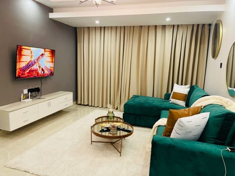 Apartment, 3 Bedrooms | Living room | Flat-screen TV