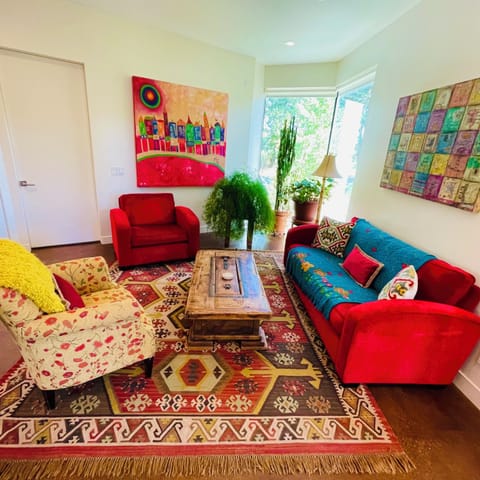 Open living space with 65" TV.