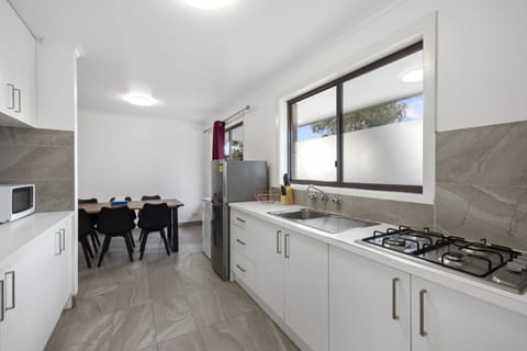 Three Bedroom Apartment | Private kitchen | Fridge, microwave, coffee/tea maker, electric kettle