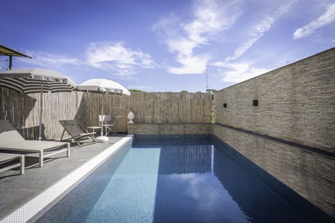Seasonal outdoor pool, pool umbrellas, sun loungers