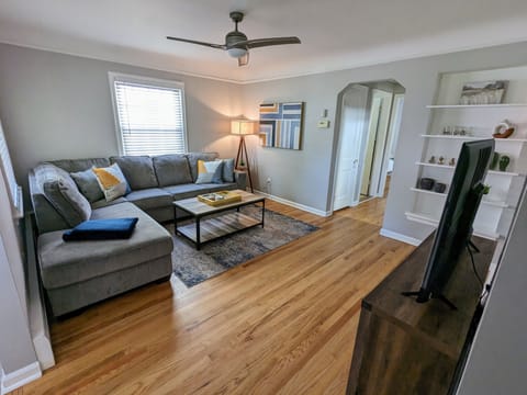 Cozy living room featuring 54" smart tv and large sectional sofa