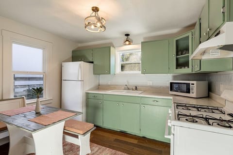 Private kitchen has cozy breakfast nook.