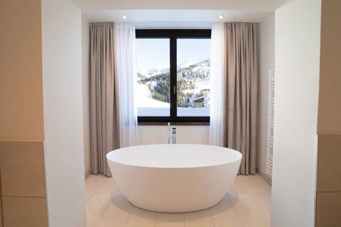 Deluxe Studio | Bathroom | Hair dryer, bathrobes, slippers, towels