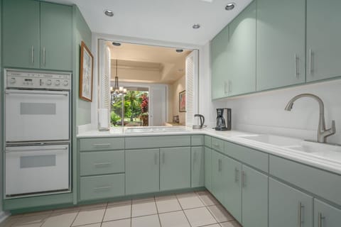 The kitchen has a pass through window to the dining room. You can see the garden while cooking.
