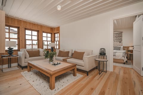 Family Quadruple Room, Multiple Beds | Living area | Flat-screen TV, smart speakers