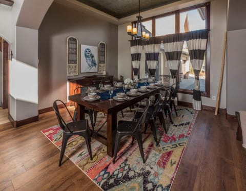 Seating for 10 at the dining table with additional seating for 4 at the bar. 