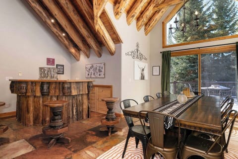 Seating for 12 at dining table with additional seating at bar and breakfast table