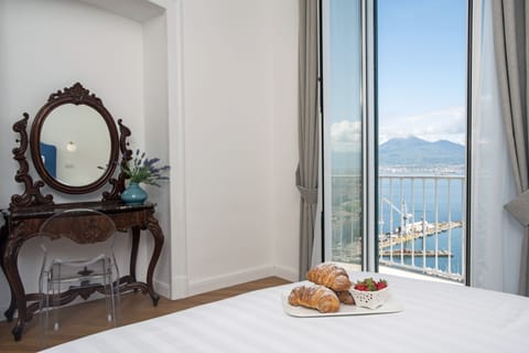 Deluxe Room, 1 King Bed, Balcony, Sea View | Minibar, in-room safe, individually decorated, individually furnished