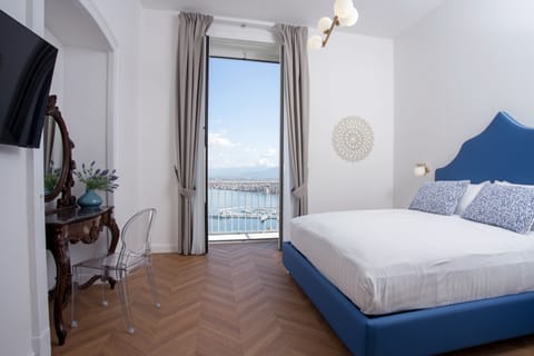 Deluxe Room, 1 King Bed, Balcony, Sea View | Minibar, in-room safe, individually decorated, individually furnished