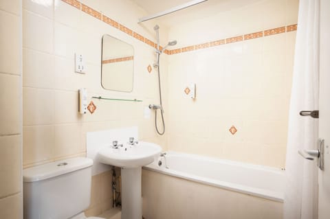 Standard Quadruple Room, Non Smoking | Bathroom | Combined shower/tub, free toiletries, hair dryer, towels