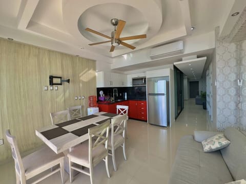 Elite Apartment | Private kitchen | Full-size fridge, microwave, blender, cookware/dishes/utensils