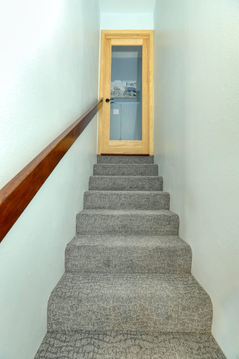 Capture a glimpse of the carpeted stairs guiding you to an exclusive second ensuite.