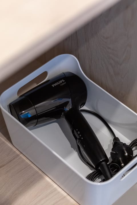 Hair dryer in the bathroom.