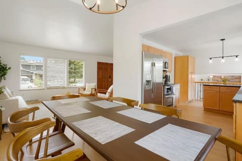 Open concept style view from dining room toward living room and kitchen