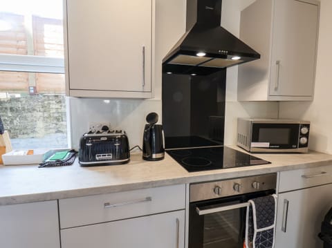 Fridge, electric kettle, toaster, cookware/dishes/utensils