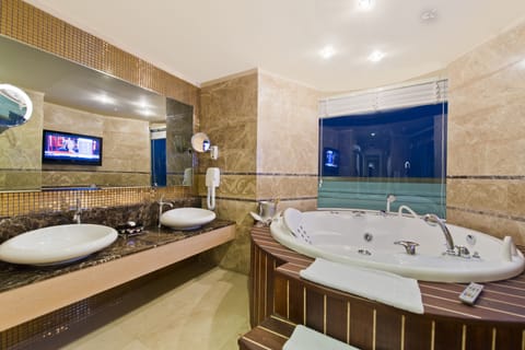 Premium Suite (Jacuzzi) | Bathroom | Combined shower/tub, free toiletries, hair dryer, slippers