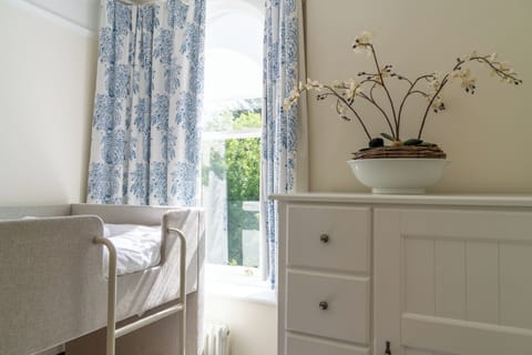 Pretty fourth bunk bedroom with full-size mattresses, perfect for adults too.