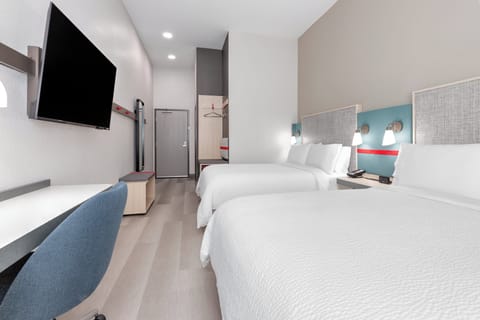 Desk, laptop workspace, blackout drapes, free cribs/infant beds