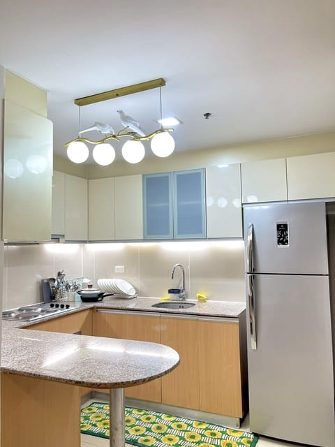 Family Condo | Private kitchen | Full-size fridge, microwave, oven, stovetop