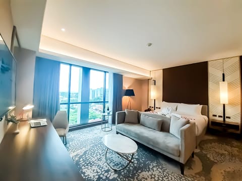 One Bedroom Suite | Living area | 49-inch LED TV with cable channels, TV