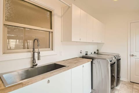 Laundry room with everything you need for longer stays; washer, dryer, and supplies.