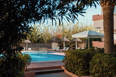 Outdoor pool, open 9:30 AM to 9:30 PM, pool umbrellas, sun loungers