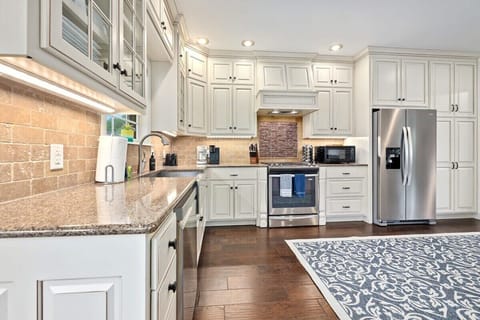 Our kitchen has a large island with four barstools as well as state-of-the-art appliances and all the essentials you need to create your favorite meal.