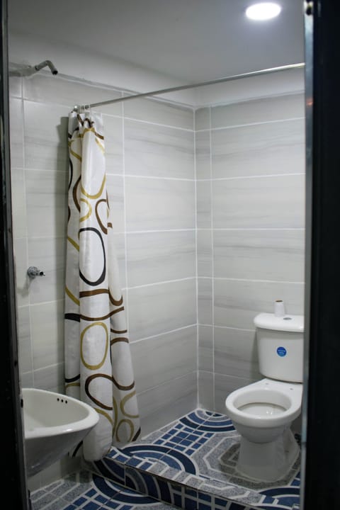 Separate tub and shower, rainfall showerhead, bathrobes, heated floors