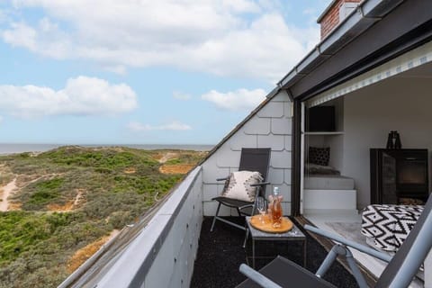 Cozy terrace with beautiful views of the dunes and the sea