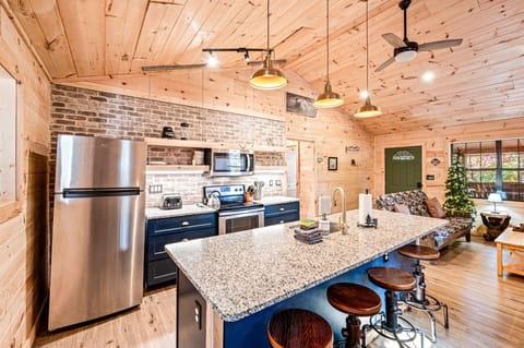 Granite countertops and industrial-style barstools elevate this inviting kitchen.