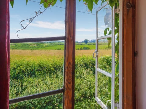 View from bedroom across the field that has a public footpath | The Cottage, Stockton