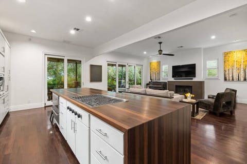 Chef`s Kitchen with commercial appliances and walks out to huge living and balcony!