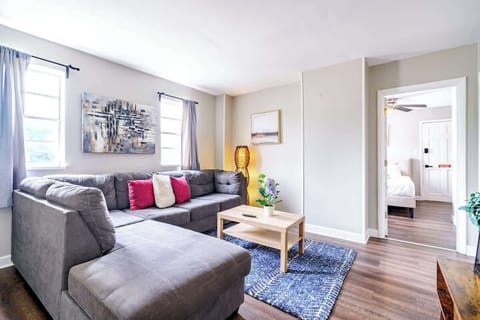 Modern and Inviting: Our living room offers modern furnishings in a clean, spacious setting. Enjoy the comfortable seating and welcoming environment. Perfect for relaxation and socializing Airbnb near Ohio State University Columbus!