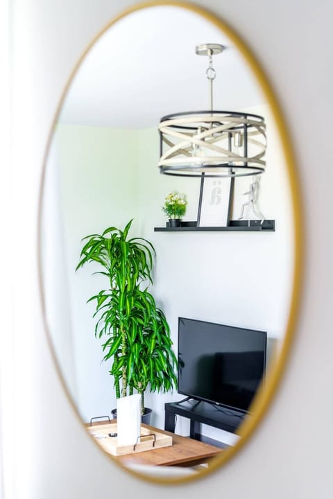 Embrace the cozy elegance of our well-designed living space, accentuated by the charming additions of a wall mirror, flowerpot, and vase. Experience comfort and style in our welcoming Your Favorite Ohio Airbnb!