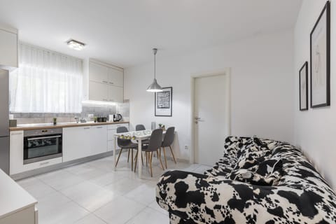 Deluxe Apartment | Living area | 150-cm LCD TV with digital channels, TV, toys