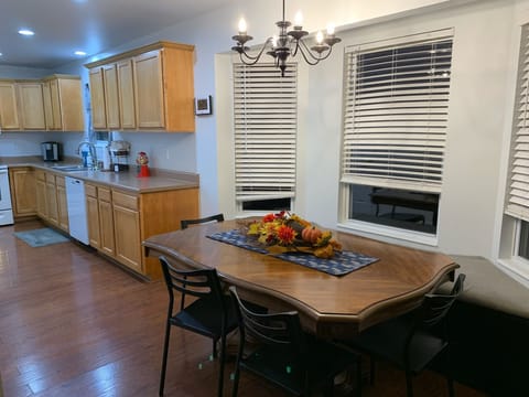 The galley style kitchen has a kitchen table with window seat on one side