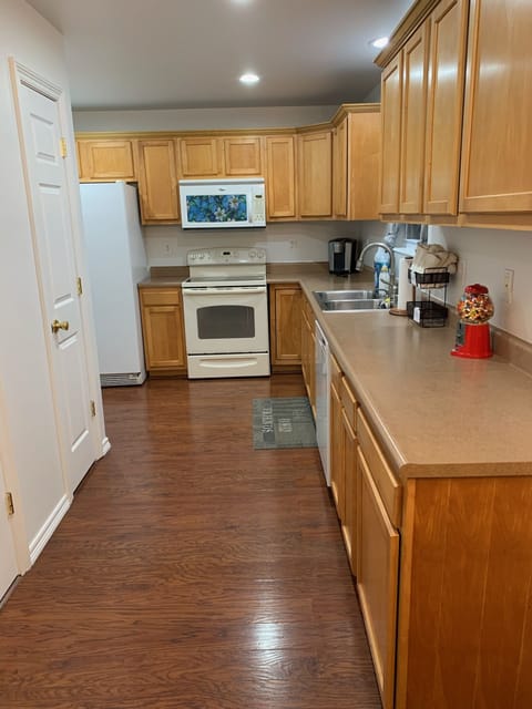 Kitchen has convection stovetop with Microwave hood and dishwasher.