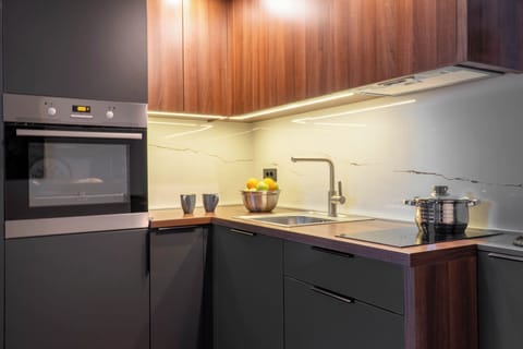 Standard Apartment | Private kitchen | Mini-fridge, oven, highchair, cookware/dishes/utensils