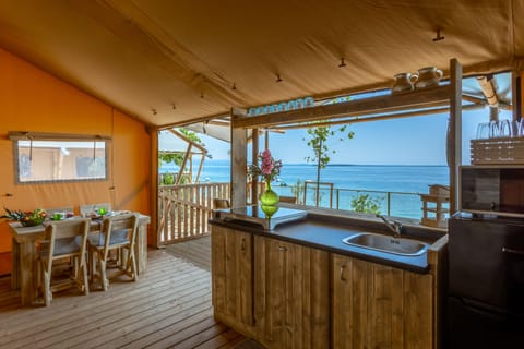 Deluxe Tent, Lake View | Living area | 32-inch Smart TV with digital channels