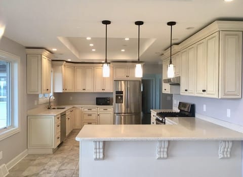 Spacious kitchen that is well-stocked plus gas stove 