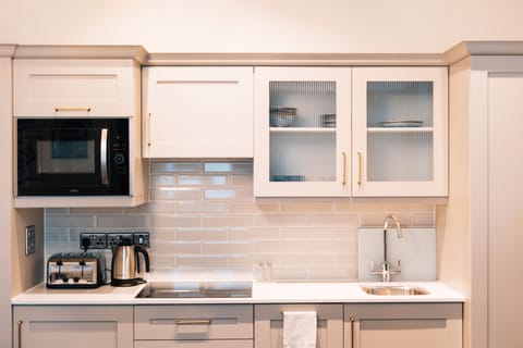 Heritage Suite | Living area | 55-inch LED TV with satellite channels, DVD player