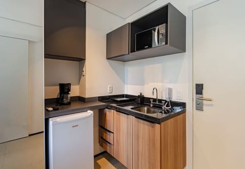 Business Studio | Private kitchen | Microwave, stovetop, espresso maker, dining tables