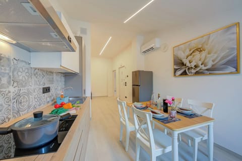 Standard Apartment, Multiple Bedrooms (Magnolia Apt - Palazzo Palermo 1817) | Private kitchen | Fridge, microwave, stovetop, dishwasher