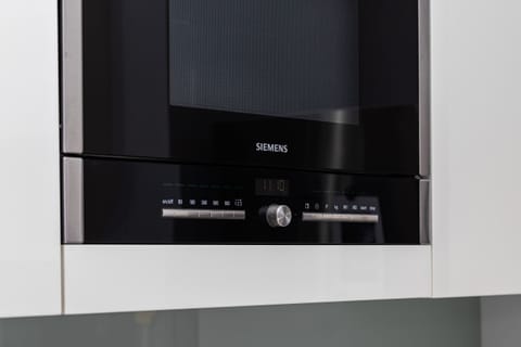 A close-up of a built-in oven, showcasing its modern and functional features.
