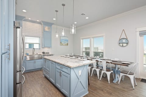 This island is ideal for preparing and serving meals. A microwave is below.