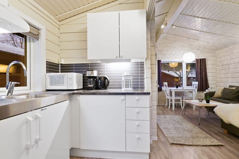 Traditional Cabin, Garden View | Private kitchen | Fridge, electric kettle, highchair