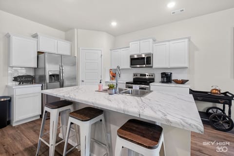 Large kitchen island with 3 barstools for casual dining!