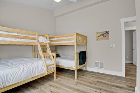 Bedroom #3 with Bunk Beds that have 1 Double Bed and 3 Single beds