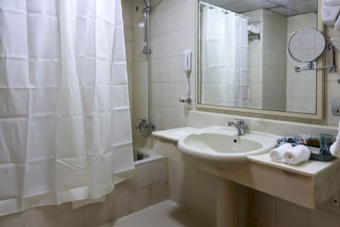 Separate tub and shower, slippers, towels, soap