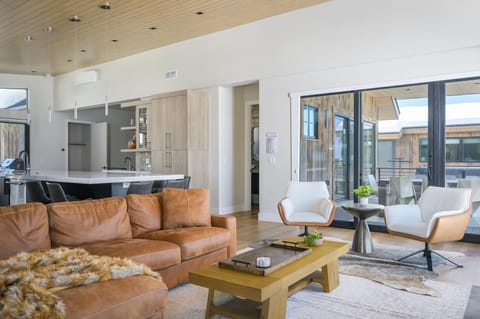 Large sliding glass doors lead out onto the back deck